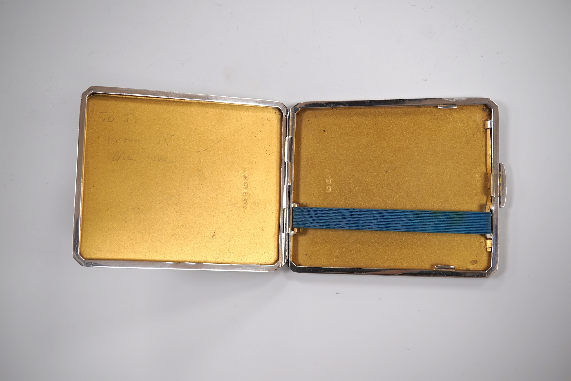 A George V engine turned silver cigarette case by Smith & Bartlam, Birmingham, 1921, a pair of Edwardian silver single handled small dishes by Goldsmiths & Silversmiths Co Ltd and a silver egg cup.